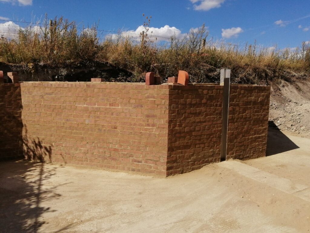 Wendover Canal narrows, block and brick wall constructed by Waterway Recovery Group canal camp
